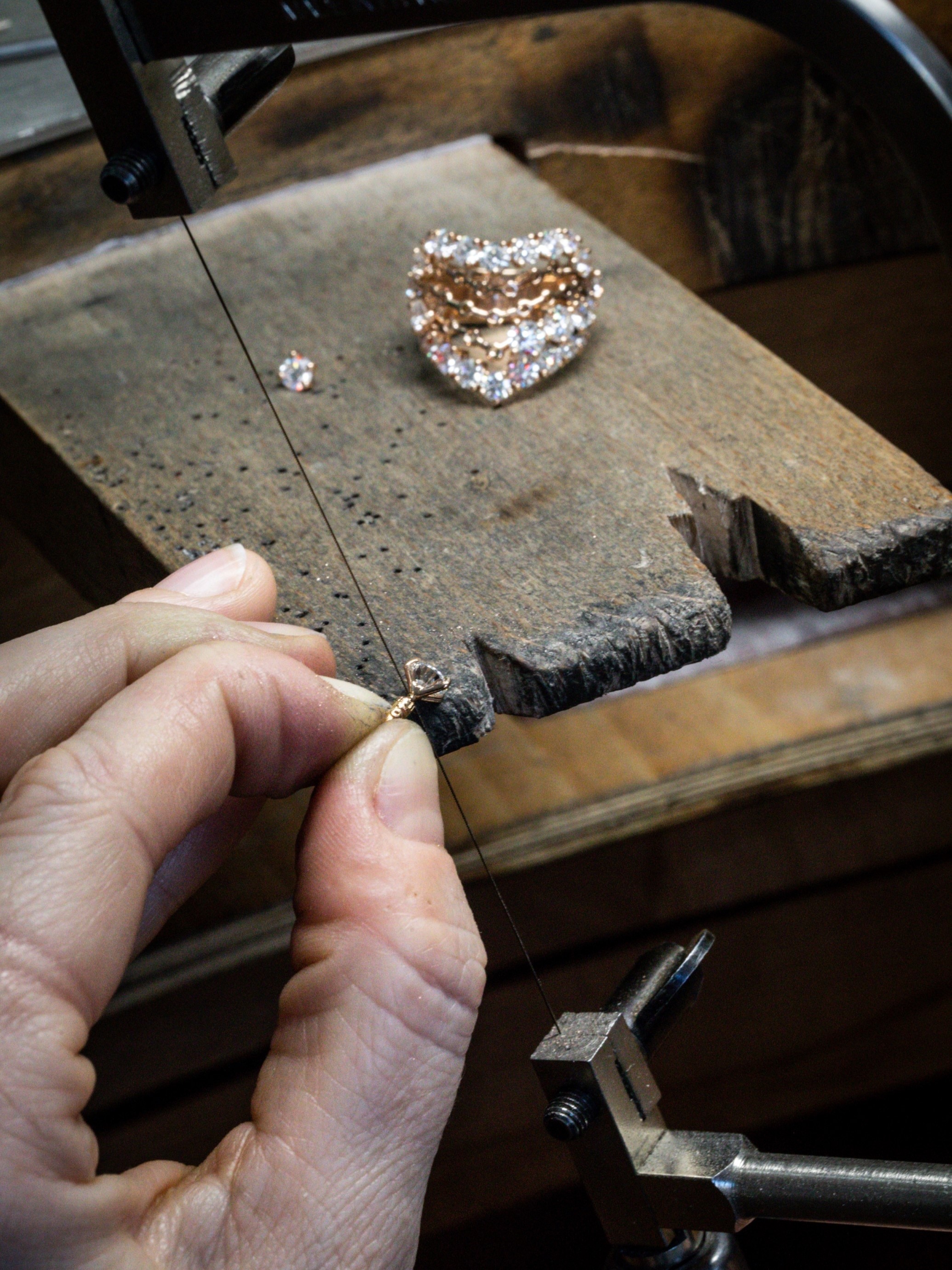 Jewelry work on the golden structure. À Cheval ring, Van Cleef & Arpels.