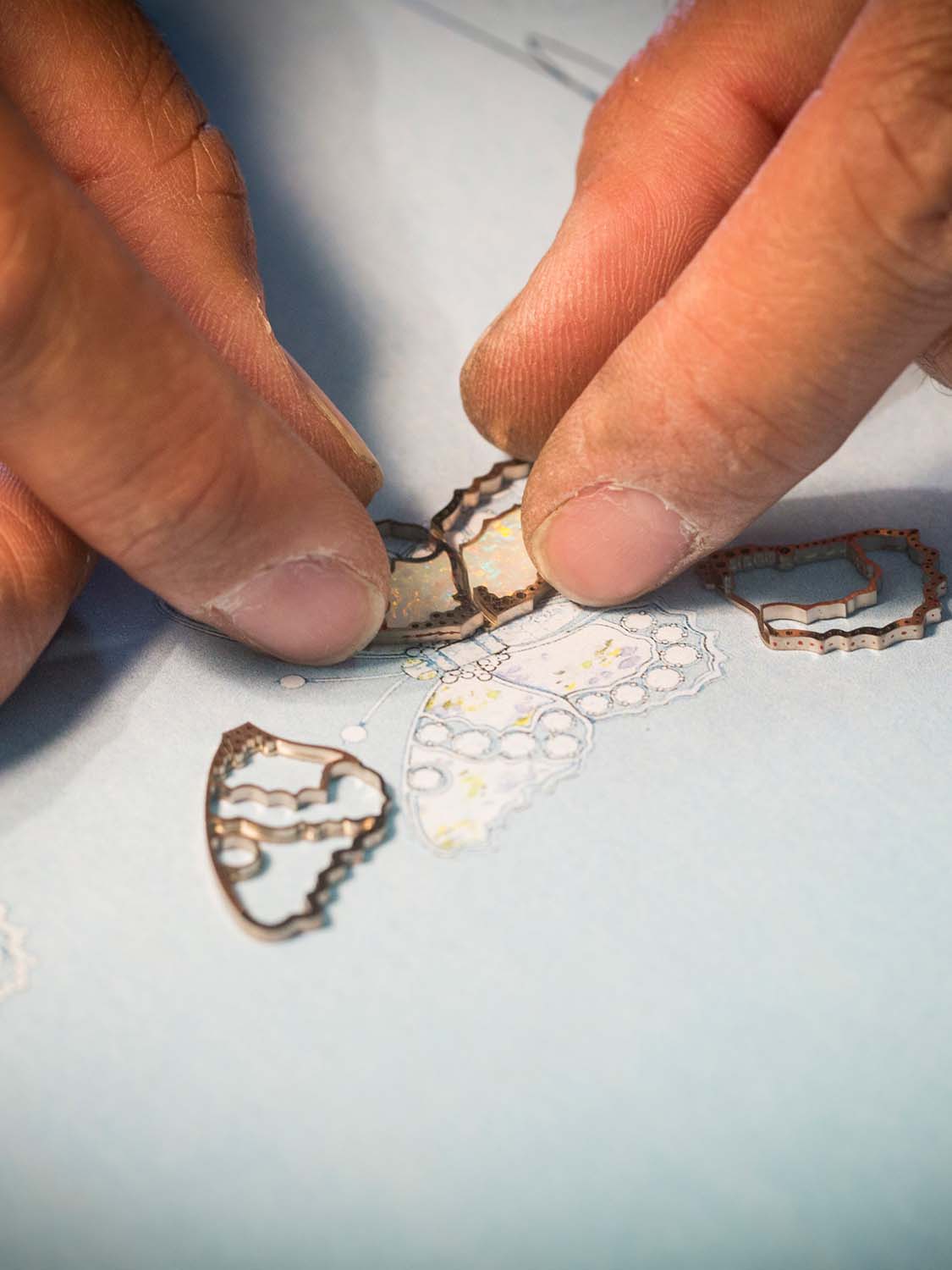 Positioning an opal in the white gold wings of the butterfly, Fée Ondine automaton. Extraordinary Object, Van Cleef & Arpels